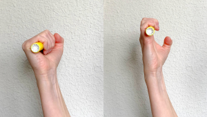Image shows how to increase finger motion by holding highlighter in full fist and hook fist