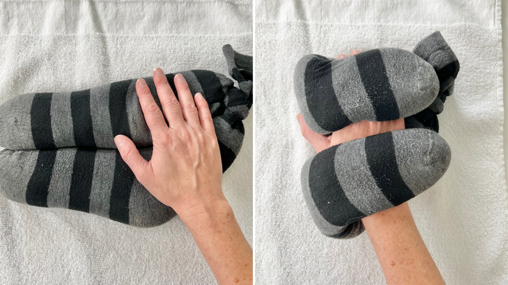 DIY hot pack placed horizontal on hand and wrist